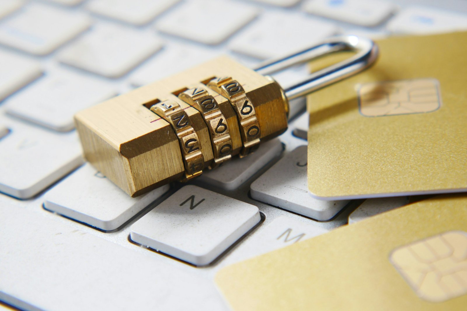 Privacy Policy 1 a golden padlock sitting on top of a keyboard
