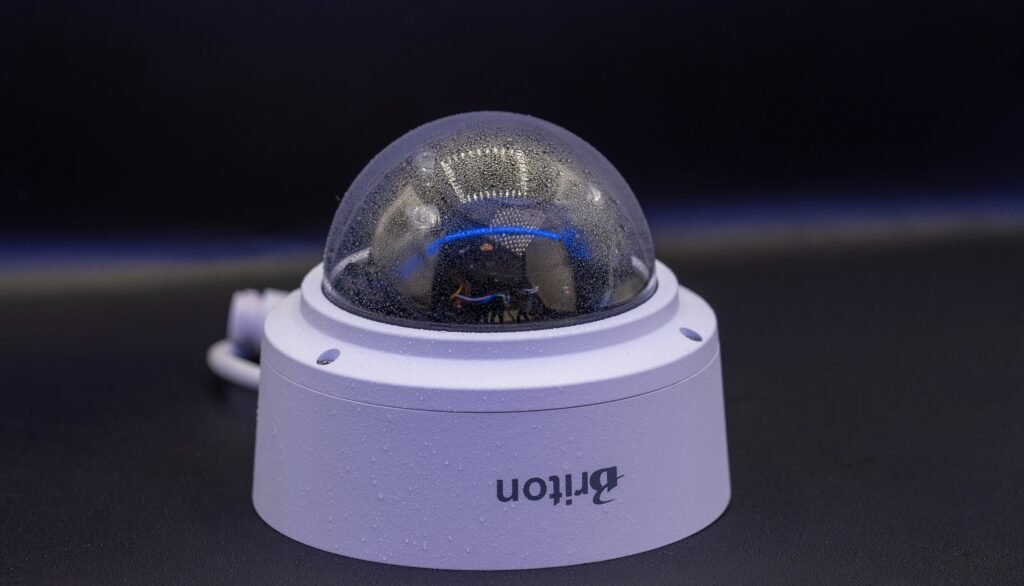 a white security camera sitting on top of a table