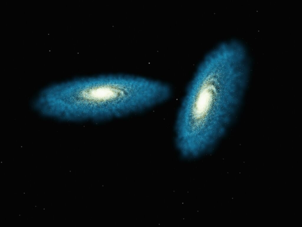 Galaxy Collision I – Approach Caption This image is a still frame from a standard video presentation (i.e., for television instead of a planetarium dome) of the galaxy collision scientific visualization. The two galaxies are being pulled together by their mutual gravity. Their shapes stay pretty much the same right up until they collide. Credits Image Frank Summers (STScI), Chris Mihos (CWRU), Lars Hernquist (Harvard)